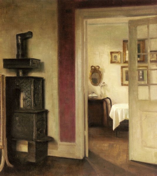 An Interior with a Stove and a View into a Dining Room