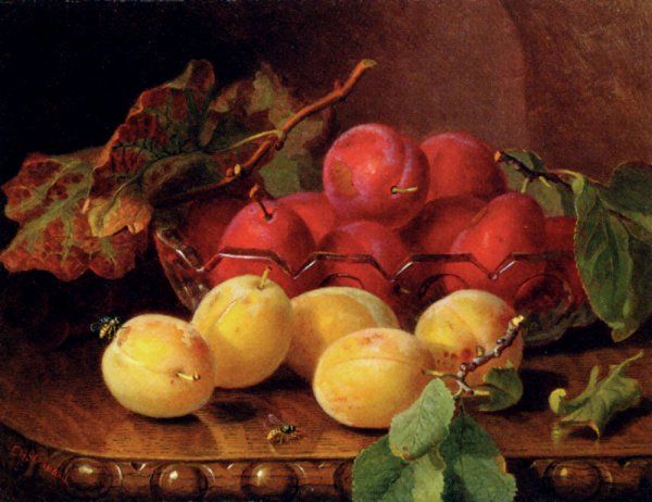 Plums On A Table In A Glass Bowl