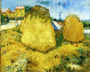 Stacks of Wheat Near a Farmhouse