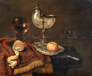 A clementine in a porcelain bowl, a nautilus cup, a roemer, two glasses, a knife, a peeled lemon on an ornamental carpet on a table by Willem Claesz Heda Oil Painting